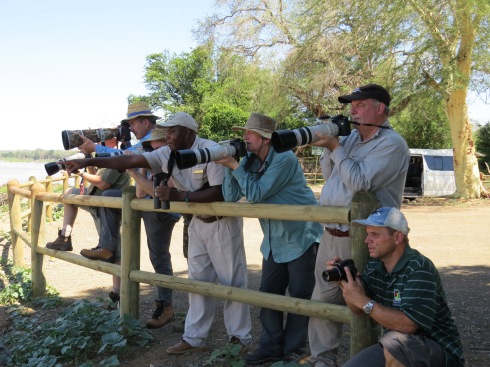 Frank Mabasa ( center ) pointing out a variety of fire finch species that could be seen at Crooks corner near the Pafuri picnic spot in the Kruger National Park. Photo Eelco Meyjes 